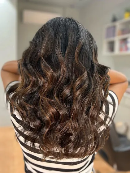 A classic chocolate brown balayage. This color is rich, timeless, and always looks incredibly chic and healthy.