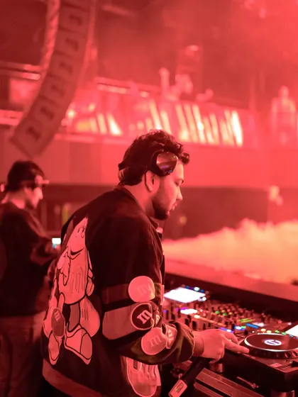 In the zone at Vagalume, Goa, with the red lighting creating an intense, high-energy atmosphere.