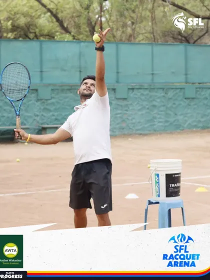 A coach demonstrates the proper serving motion. Our certified coaches lead by example, providing clear, hands-on instruction to help players master every part of the game.