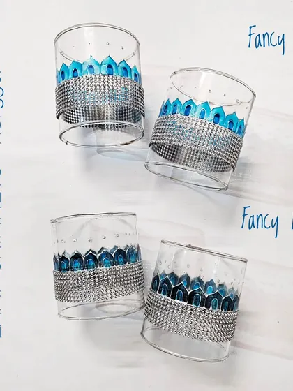 The 'Fancy Blue' and 'Fancy Indigo' lamp chimneys. The silver beaded lace adds a touch of glamour to the hand-painted designs.