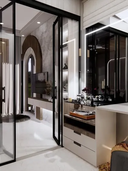 A view from the bedroom into the walk-in closet and dressing area. The open layout and consistent design language create a cohesive and highly functional master suite.