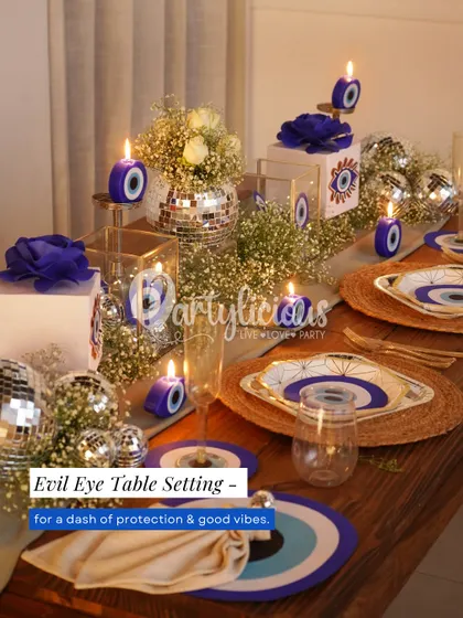 A closer look at the Evil Eye table setting. The theme is carried through every detail, including the custom plates, coasters, and even the candles, ensuring a cohesive and immersive experience for your guests.