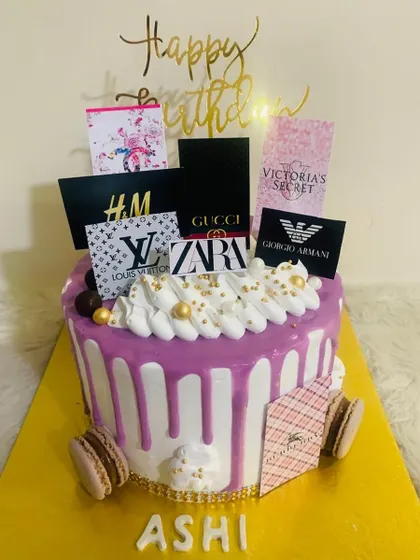 For the shopaholic in your life! This fun drip cake is decorated with edible logos of top fashion brands like Gucci, Zara, and Louis Vuitton.