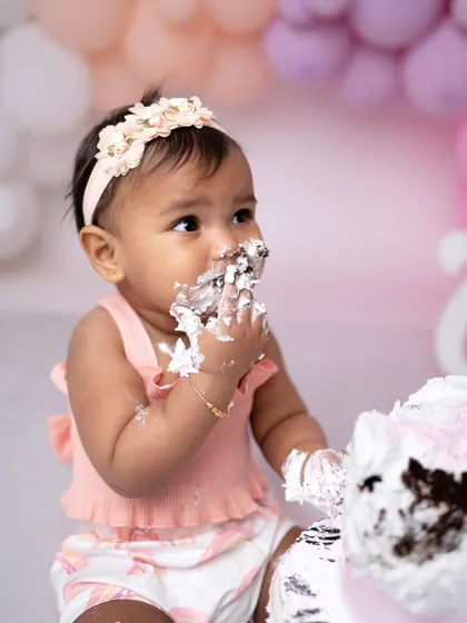 A close-up shot capturing the delicious mess. These photos are all about celebrating the fun and freedom of being one.