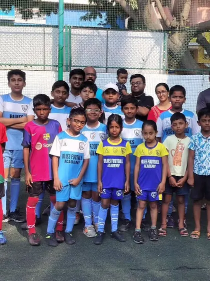 A group photo of players, coaches, and parents, highlighting the family atmosphere of our academy.