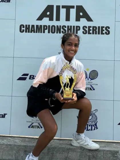 Lucy Roy posing with her winner's trophy after securing the Under-16 singles title at the All India Championship Series in Mumbai.
