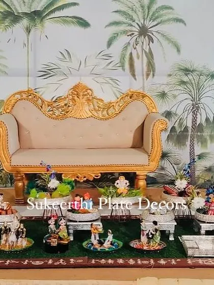 A beautiful, thematic plate decoration for a Kongu wedding engagement, featuring a large collection of dolls depicting various traditional scenes.