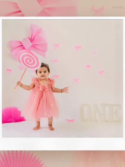 Twirling into her first birthday! This pink-themed shoot with a giant lollipop prop is all about fun, sweetness, and celebrating being one.