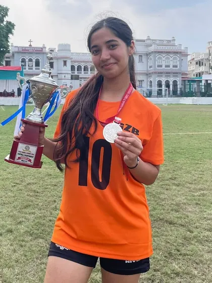 Meet Tushitaa, a dedicated player who has been with us for over 8 years. Here she is, proudly holding her medal and the runners-up trophy from the regional tournament.