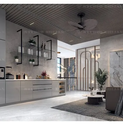 This view of the Kirti Nagar lobby shows the open-plan kitchen and bar area, making it a perfect space for entertaining.