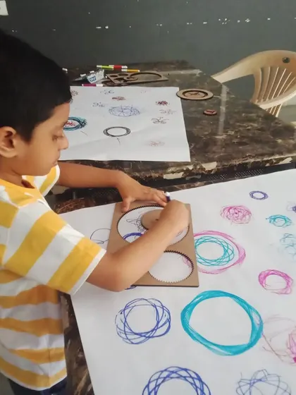 Exploring the beauty of math and art by creating spirograph patterns. This activity is a fun, hands-on way to learn about gears and geometry.