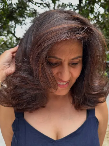 A happy client with her 'Chocolate Truffle' hair.