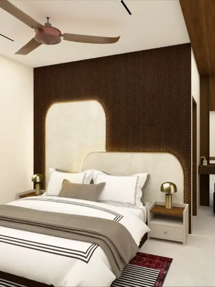 This bedroom design uses a dark, textured wallpaper to create a sophisticated and moody backdrop. The custom-designed headboard with curved edges softens the look. The abstract art adds a splash of color and personality.