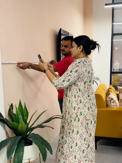 The not-so-glamorous side of setting up a new office. Here we are, measuring walls and planning layouts to make the space perfect.