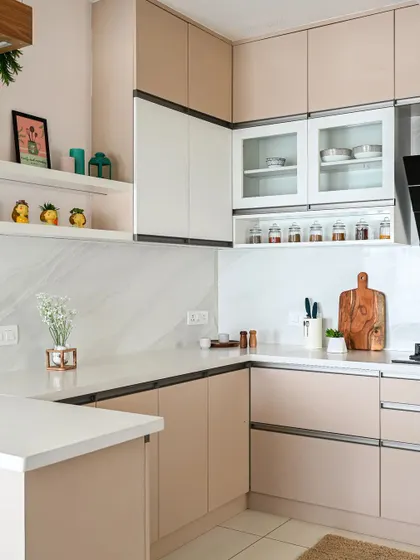 A minimalist kitchen with pastel-colored cabinets and a white marble backsplash. The open shelves are perfect for displaying decorative items and keeping everyday essentials within reach.