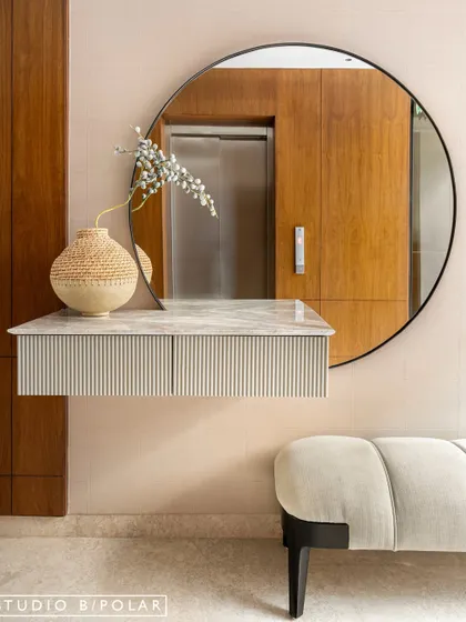 In the transitional spaces of Noor Haus, like hallways and lift lobbies, we used warm wood paneling, sculptural furniture, and curated art to turn these "in-between" zones into beautiful design moments.