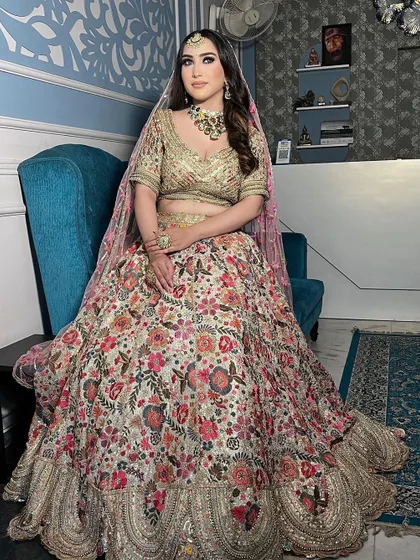 A beautiful floral printed lehenga, perfect for a day wedding or a bridesmaid. The heavy embroidery on the blouse adds a touch of glamour.