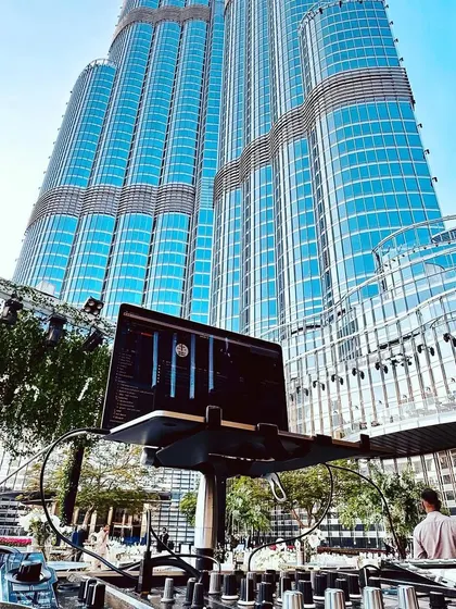 My DJ setup with the Burj Khalifa as the backdrop in Dubai. We can set up a world class sound and visual experience anywhere, ensuring the party is epic no matter how grand the setting.