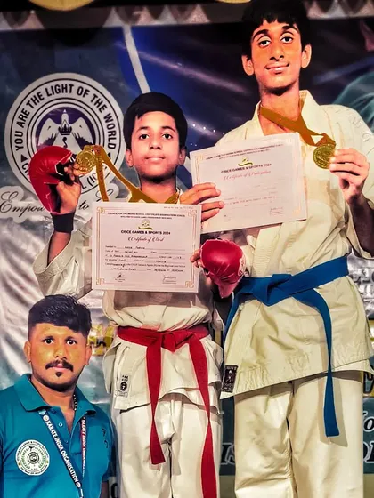 Two of my students, a red belt and a blue belt, celebrating their victories at the state championship. Both have been selected to compete at the national level.