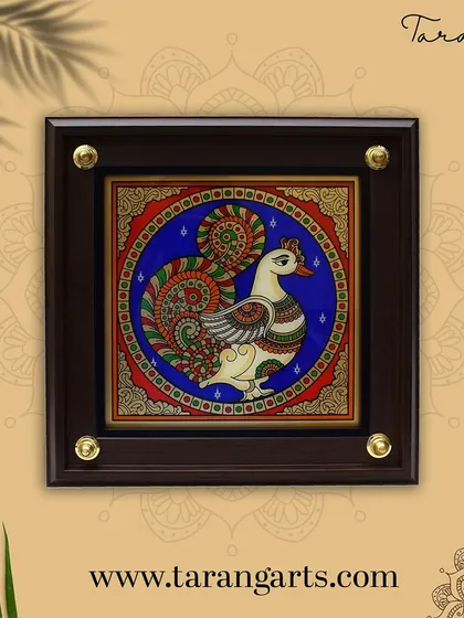 The mythical Annapakshi, a divine swan-like bird, is beautifully rendered in this glass painting. A symbol of purity and prosperity in South Indian culture, this piece brings a touch of divine elegance to your home.