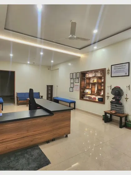 A full view of our reception and waiting area. We designed this space to be welcoming and peaceful, a place where you can transition calmly from the outside world into your practice.