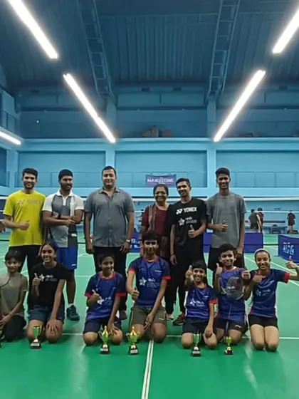 The champions and our coaching team after a successful internal tournament. We believe in celebrating our players' efforts and fostering a supportive community.