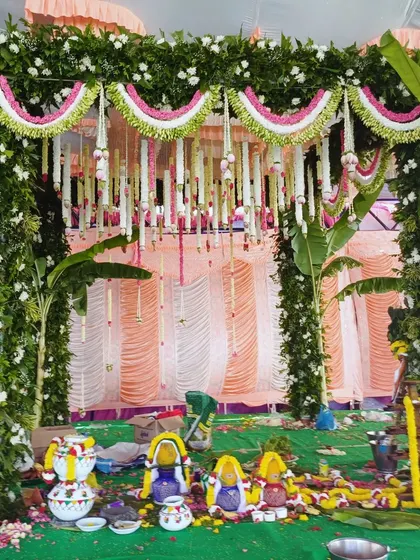 A traditional mandap setup with colorful pots and offerings for the wedding ceremony.