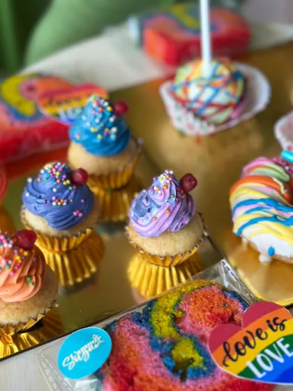 More of our 'Baked with Pride' collection, showing colorful cupcakes and rainbow cake slices, all made to celebrate love and diversity.