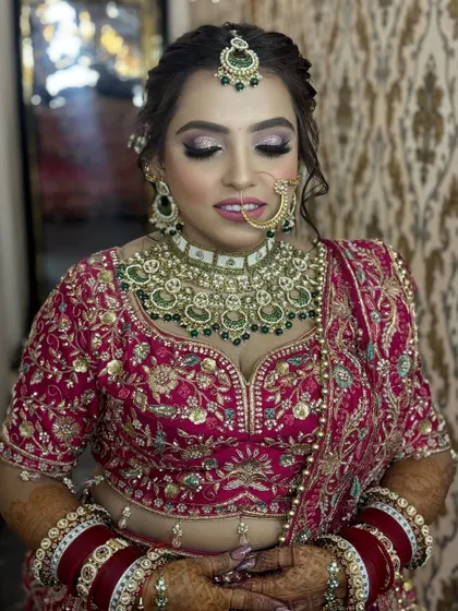The same beautiful bride, showcasing her complete look. The makeup is radiant and enhances her features without looking heavy, perfect for a long day of celebrations.