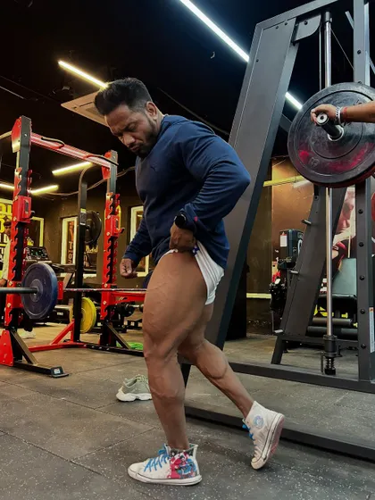 Iconic leg development. Checking the quad separation and size after a tough workout.