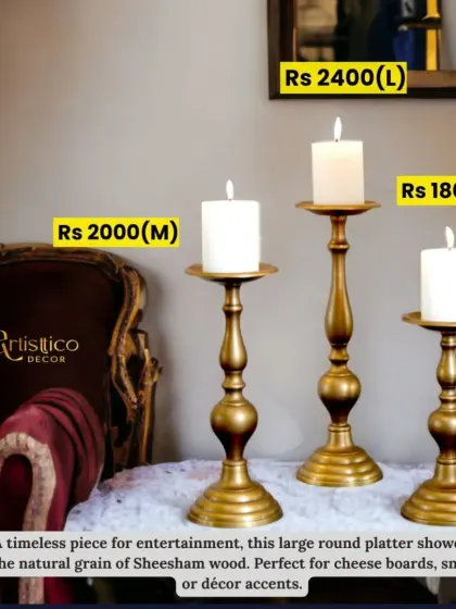 This set of three timeless candle stands in an antique brass finish adds varying heights and a warm glow to any corner.