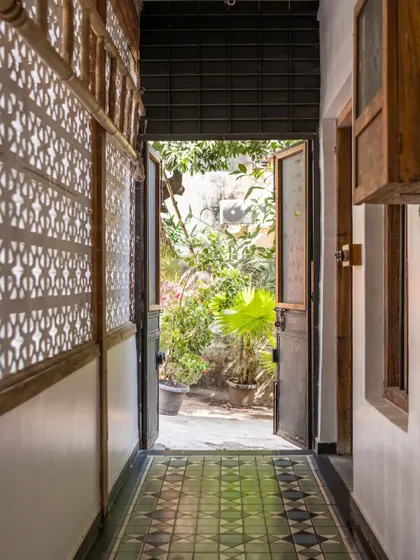 A hallway in my studio, where the play of light and shadow on the restored 'jaali' screen creates beautiful patterns on the floor. This is what I mean by a space having a conversation with its elements.