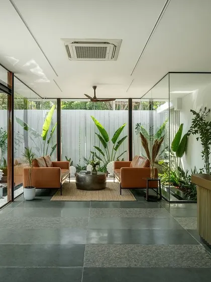 A duplicate view of the Soul Spring reception, offering a wider perspective of the open-plan space and its connection to the exterior courtyard.
