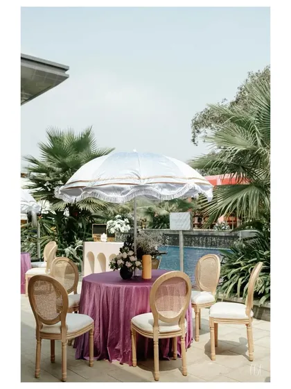 A pastel-themed Haldi setup by the pool. The soft color palette and elegant seating created a chic, relaxed vibe for this daytime event.