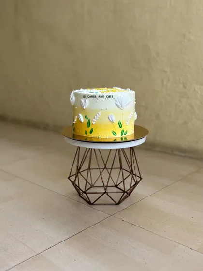 A full view of the yellow ombre floral cake, a bright and cheerful choice for any celebration.