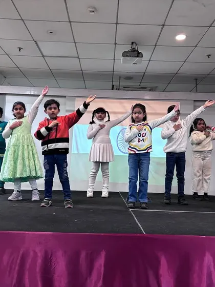 The students strike a patriotic pose, saluting the nation at the conclusion of their powerful Republic Day performance.