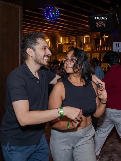 A moment of connection on the dance floor at La-Fro Nights. It is a great way to meet new people and build friendships within the dance community.