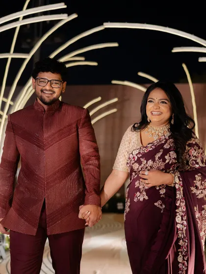 A beautiful portrait of the couple, their smiles and coordinated outfits radiating warmth and happiness.