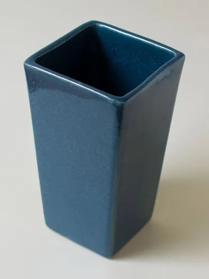 An empty Nile planter, showcasing its sleek, rectangular form and the deep, rich color of its glaze.