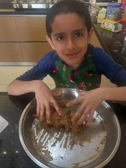 My son Kai learning to bake gingerbread cookies. This activity was a wonderful lesson in patience, following instructions, and the joy of creating something with his own hands.