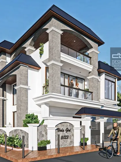 A series of images showcasing the "Veda Giri" residence, a beautiful traditional home design. The house features prominent columns, bay windows, and a distinctive sloped roof design, blending classical Indian elements with a modern sensibility.