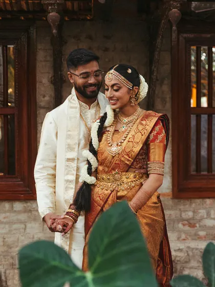 A classic portrait of the couple in their traditional wedding attire. We scout the perfect locations within the venue that complement their look and the heritage theme of the event.