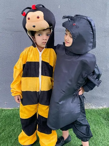 Little wings and tiny feet. Two boys dressed as a bee and an ant for our 'Insects' theme day, bringing the world of creepy crawlies to life with their adorable costumes.