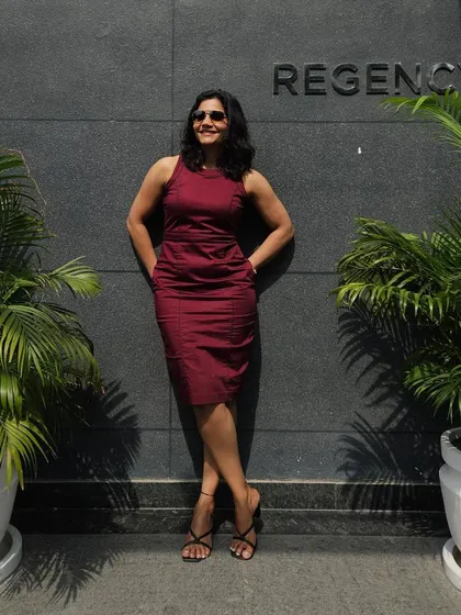 Taking a moment between meetings. My fitness journey gives me the energy and confidence to handle a demanding professional life.