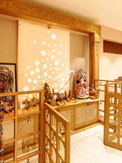 A spiritual corner should feel sacred and personal. I designed this handcrafted wooden pooja unit with intricate details, including bell-adorned folding gates and a backlit Corian panel. It’s a space that blends traditional craftsmanship with modern aesthetics to create a serene oasis within the home.