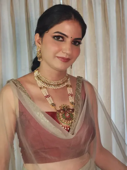 A portrait of Bhawna, showcasing her complete Mehendi look with heavy traditional jewellery.