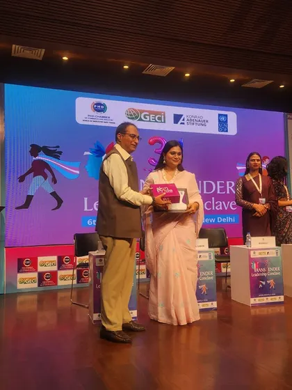 A community leader receiving an award at the conclave. We celebrate the achievements of all trans leaders.