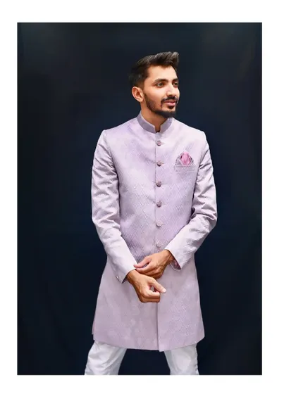 A full-length studio shot of the popular lavender Indo-western outfit. The model's pose shows how the outfit fits and flows, giving you a complete picture of this minimal yet majestic piece.