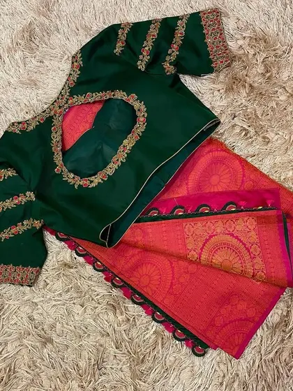 The back of the bottle green blouse, featuring a keyhole cutout and detailed embroidery.