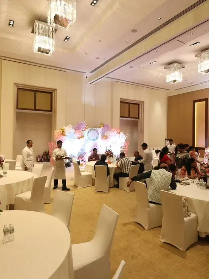 An overview of the event space, showing how our decor transforms a simple hall into a magical celebration venue. The lighting and layout are all part of our comprehensive event planning service.